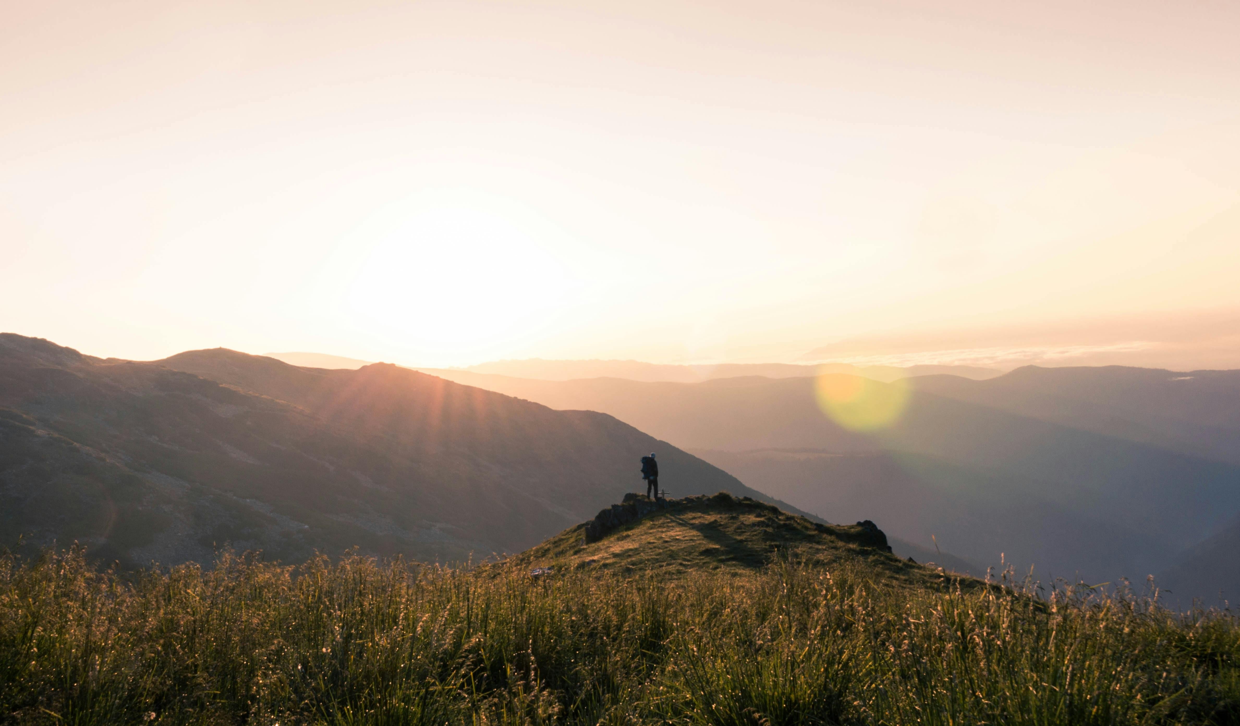 person on mountain summit